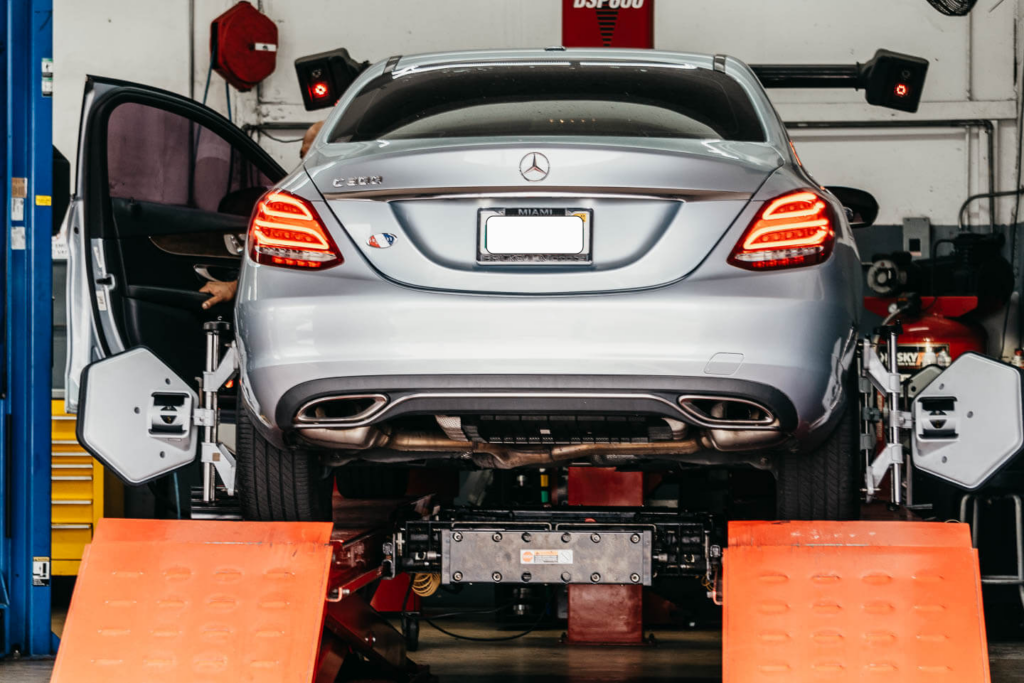 Silver Mercedes-Benz C-Class in service bay at Miami Benz, South Miami FL