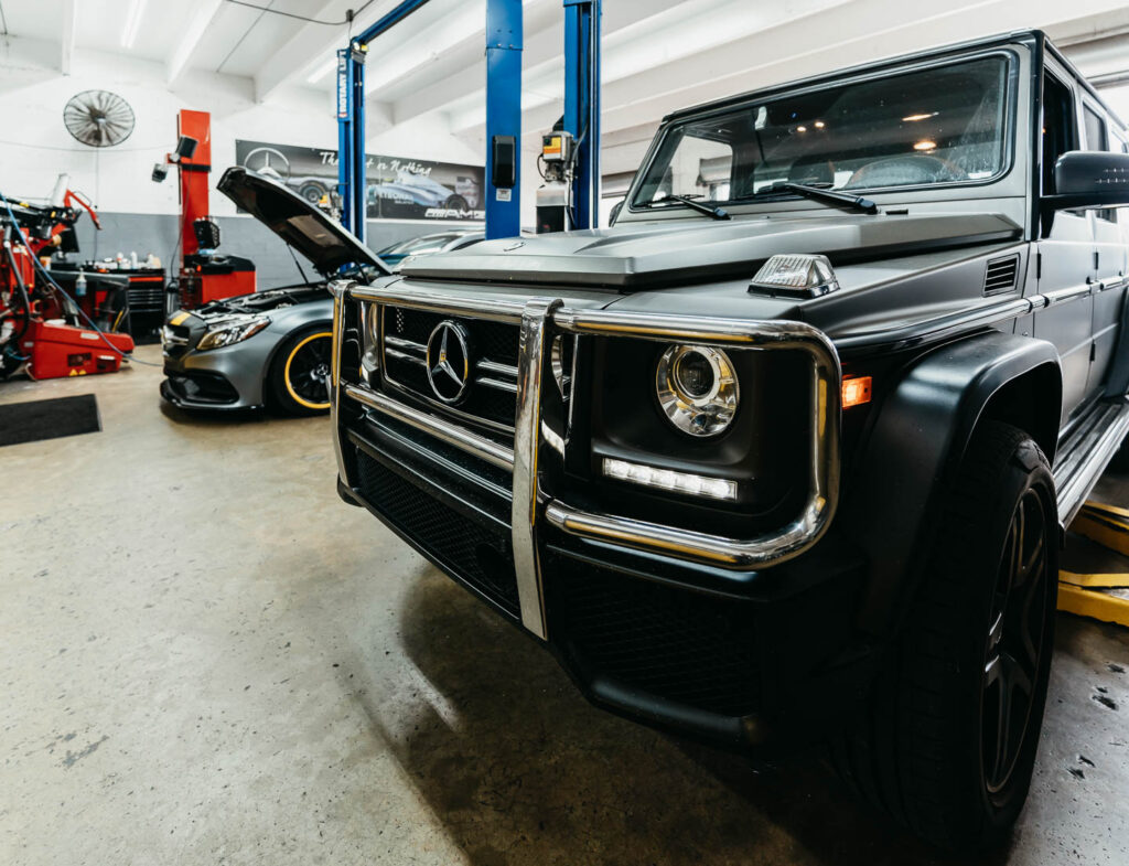 Mercedes-Benz G-Class and C-Class awaiting service at Miami Benz, ISP-licensed workshop in South Miami