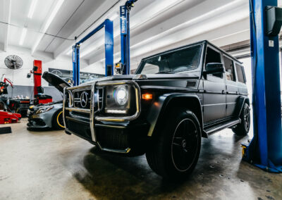 Sleek Mercedes-Benz G-Class in the well-equipped Miami Benz service center, showcasing their expertise in luxury vehicle care.