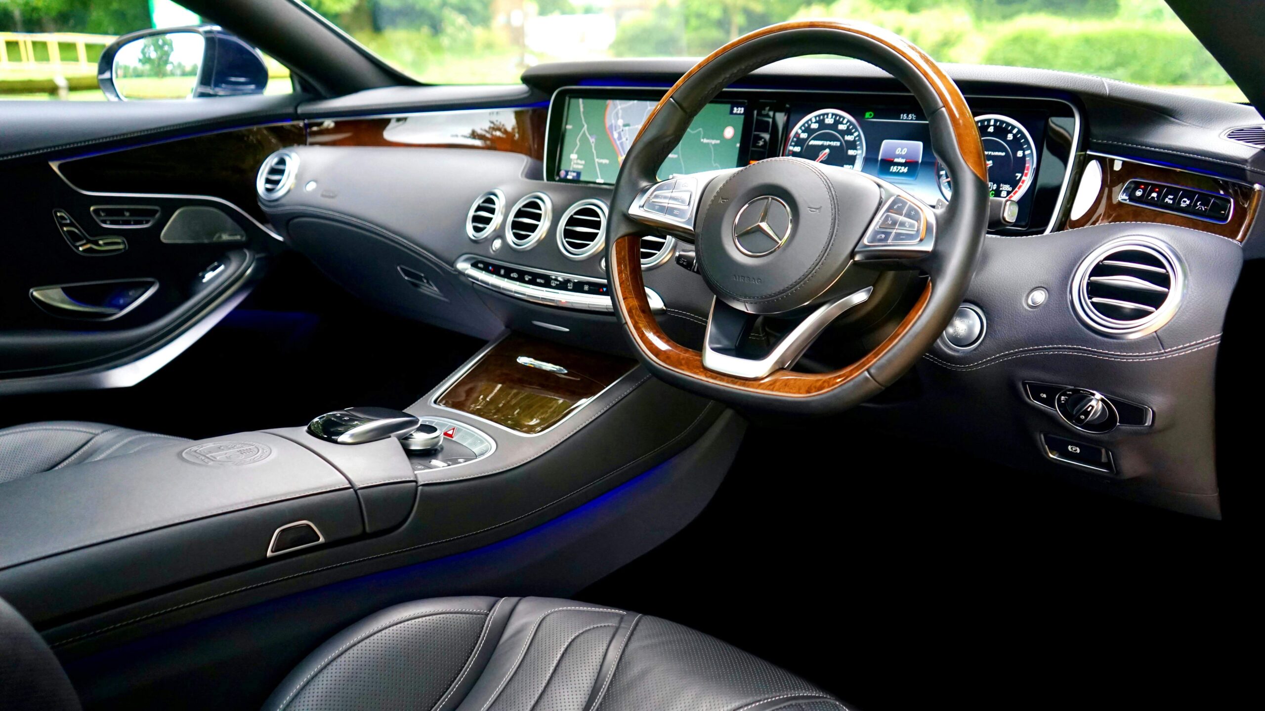 Mercedes-Benz dashboard warning lights guide — Miami Benz Interior view of a luxury Mercedes-Benz dashboard showing instrument cluster and warning light display