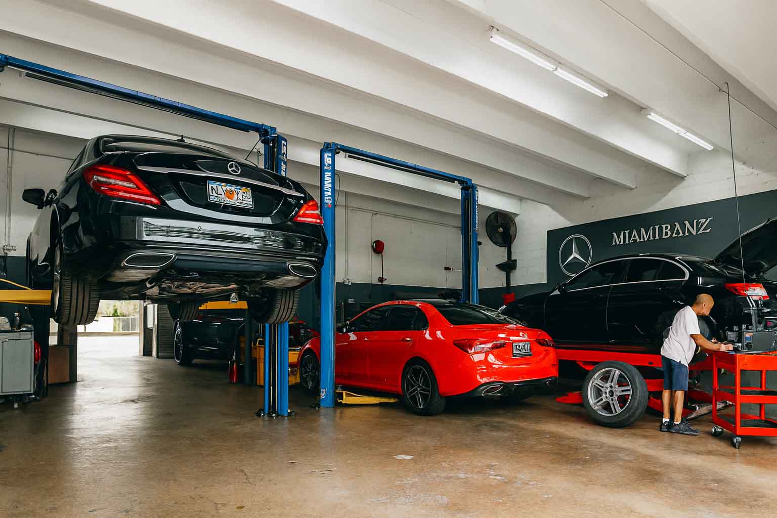 Mercedes-Benz in a Miami workshop on a lift for professional brake repair service