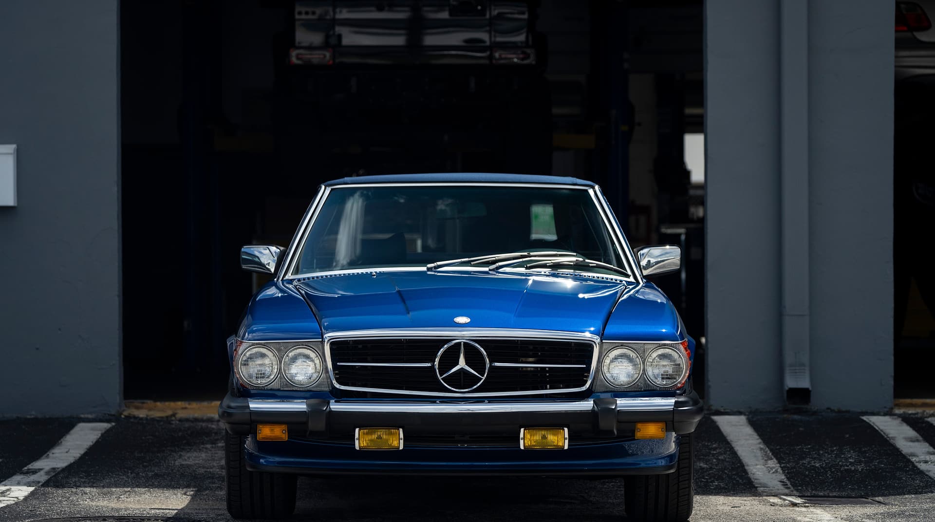 Project #1: 1979 Mercedes-Benz 450 SL Blue 1979 Mercedes-Benz 450 SL, the Miami Benz Project #1 restoration, parked in a service bay at the South Miami workshop.