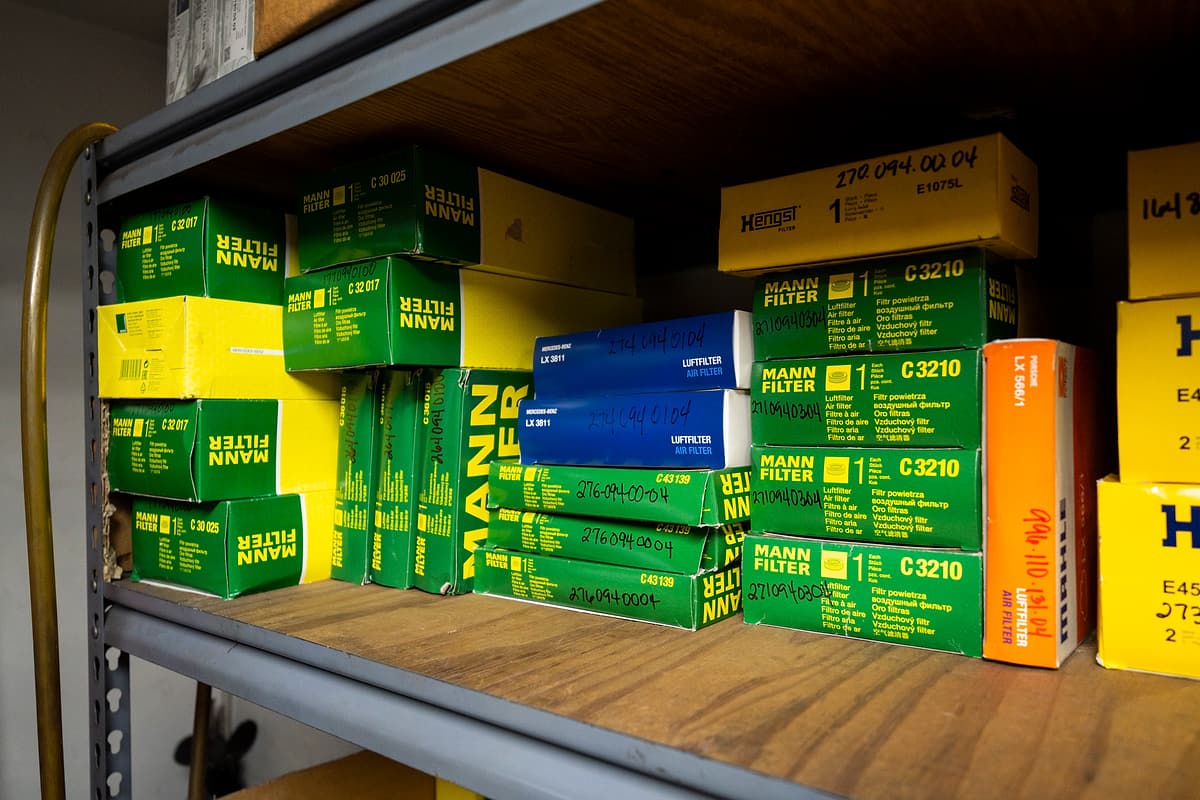Shelves of filters and service parts at the Miami Benz workshop.
