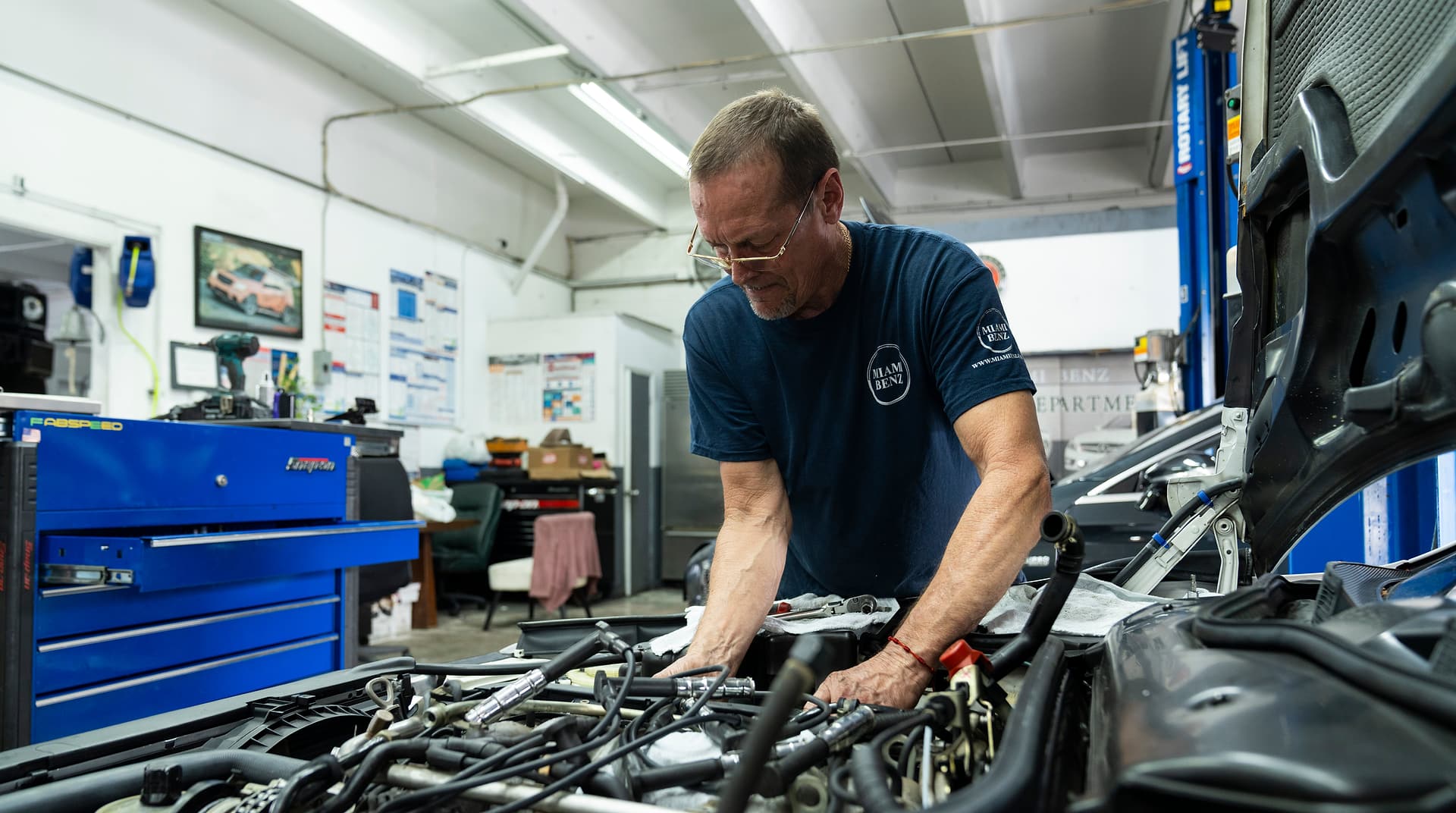Mercedes Repair Estimate Second Opinion — Miami Benz South Miami Miami Benz technician assessing a Mercedes engine bay during a second opinion review in South Miami